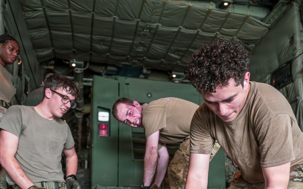 Joint service members load cargo for Nepal lifesaving operations