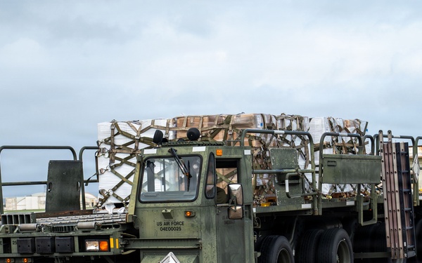 Joint service members load cargo for Nepal lifesaving operations