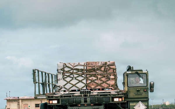 Joint service members load cargo for Nepal lifesaving operations