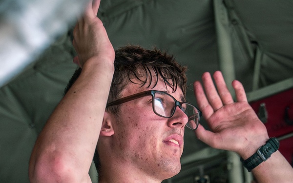 Joint service members load cargo for Nepal lifesaving operations
