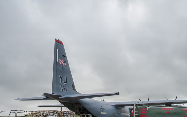 Joint service members load cargo for Nepal lifesaving operations