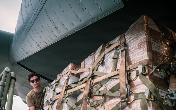 Joint service members load cargo for Nepal lifesaving operations