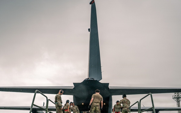 Joint service members load cargo for Nepal lifesaving operations