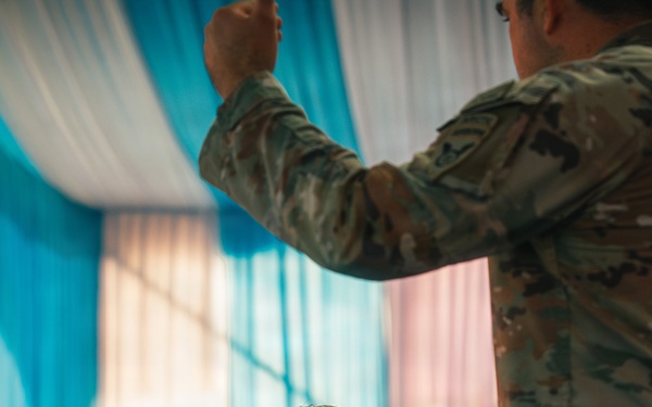 1st Special Force Group (Airborne) Green Berets coordinate an Upcoming Airborne Operation with 1st Battalion 501st Infantry Regiment, 2nd Brigade, 11th Airborne Division