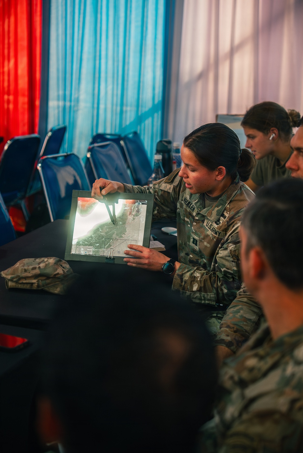 1st Special Force Group (Airborne) Green Berets coordinate an Upcoming Airborne Operation with 1st Battalion 501st Infantry Regiment, 2nd Brigade, 11th Airborne Division