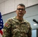 A U.S. Army lieutenant general named McFarlane is speaking at a podium with a microphone. He is wearing an OCP (Operational Camouflage Pattern) uniform with visible name tape, U.S. Army tape, a Ranger tab, and three-star rank insignia. An American flag is visible in the background.