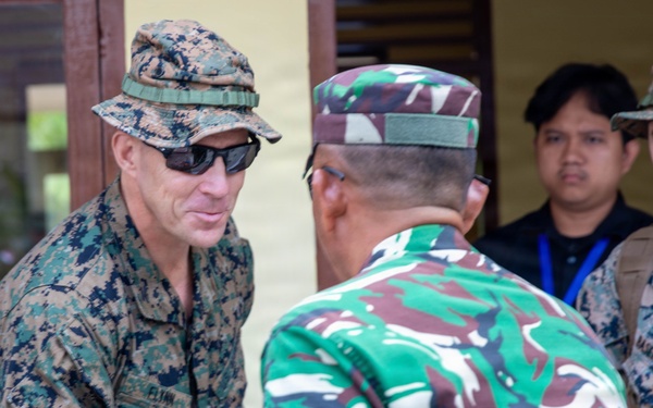 U.S. Marine Corps Col. George Flynn shakes hands with an engineer