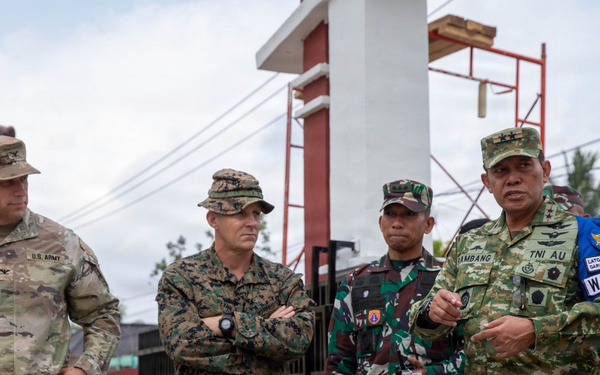 U.S. Army Col. Robert Lawrence and U.S. Marine Corps Col. George Flynn listen to a TNI Air Force junior marshal speak