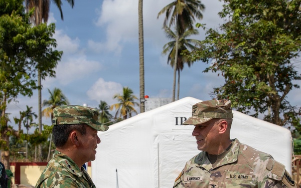 U.S. Army Col. Robert Lawrence shakes hands with partner nation