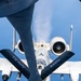 An A-10 Thunderbolt II (Warthog) attack aircraft is receiving aerial refueling from a tanker aircraft, photographed from the boom operator's position looking down at the receiver aircraft. The A-10 bears 'TENN ANG' markings on its wings, indicating it belongs to the Tennessee Air National Guard. The aircraft displays the characteristic shark mouth nose art and the refueling boom is visibly connected to the aircraft's receptacle.