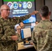A military briefing or coordination session is taking place in what appears to be a cyber operations center. A Canadian Armed Forces officer (name tag reads 'OSMOND') wearing CADPAT camouflage is gesturing and speaking to a U.S. military personnel in OCP/MultiCam uniform. The background screen displays 'CYBER FLAG 26-2 ROK – U.S. Combined Team,' indicating a joint multinational cyber exercise.