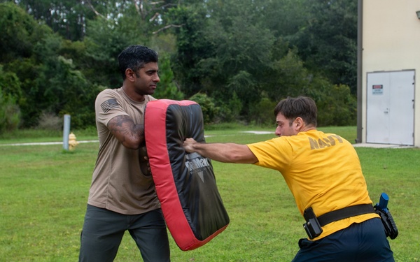 Sailors participate in oleoresin capsicum (OC) Course