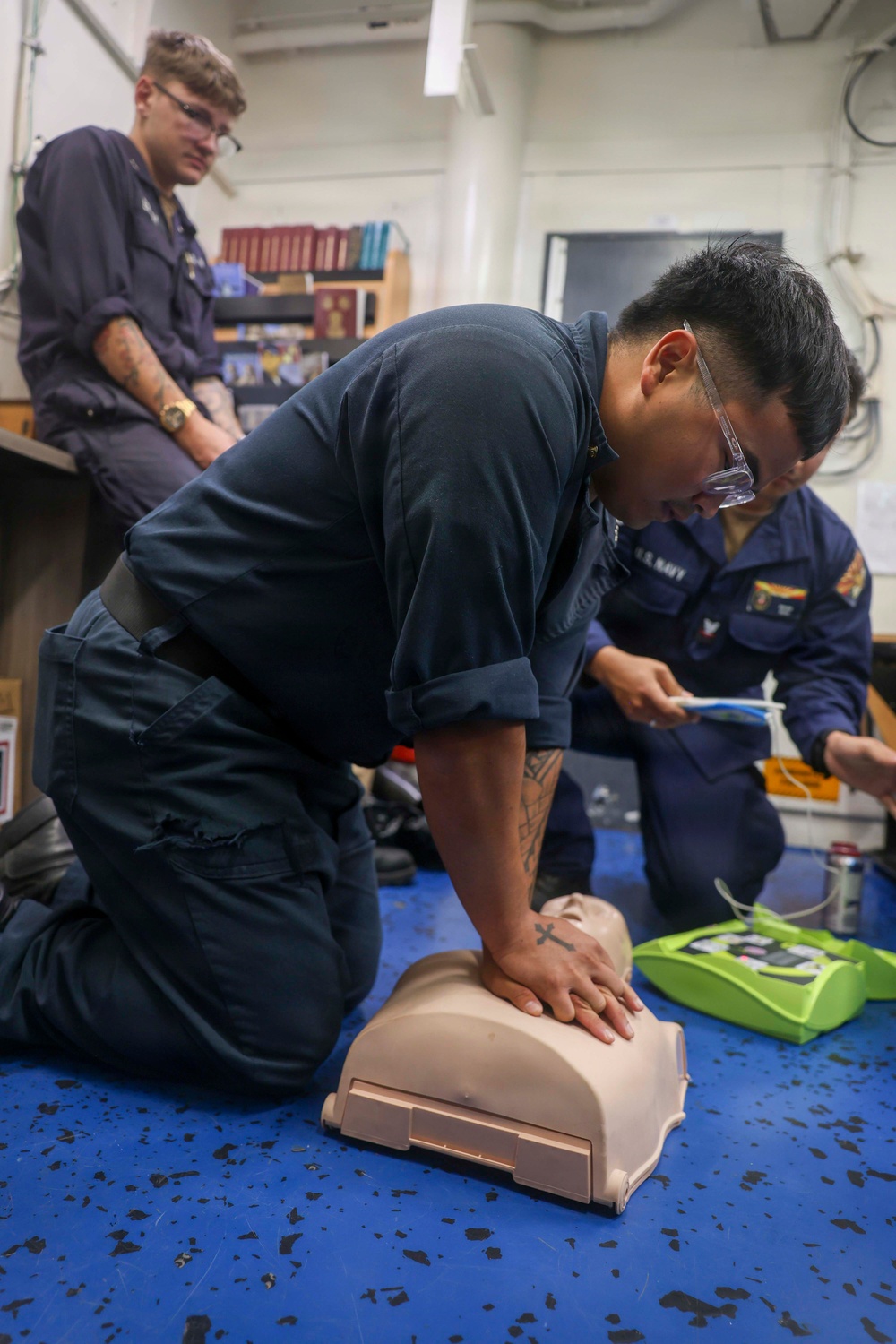 Sailors conduct CPR training aboard USS Oscar Austin