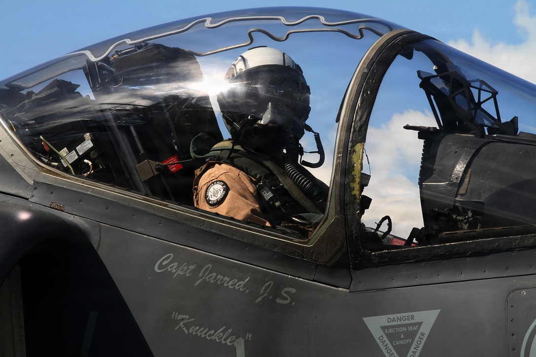 A Marine aviator piloting an AV-8B Harrier Jump Jet from Marine Medium Tiltrotor Squadron 365 (Reinforced), 24th Marine Expeditionary Unit, waits to take off from the USS Iwo Jima off the coast of North Carolina, Aug. 11, 2014. The 24th MEU is taking part in Amphibious Squadron/Marine Expeditionary Unit Integration, or PMINT, the 24th MEU’s second major pre-deployment training exercise. PMINT is designed to bring Marines and Sailors from the 24th MEU and Amphibious Squadron 8 together for the first time aboard the ships of the Iwo Jima Amphibious Ready Group. (U.S. Marine Corps photo by Lance Cpl. Dani A. Zunun)