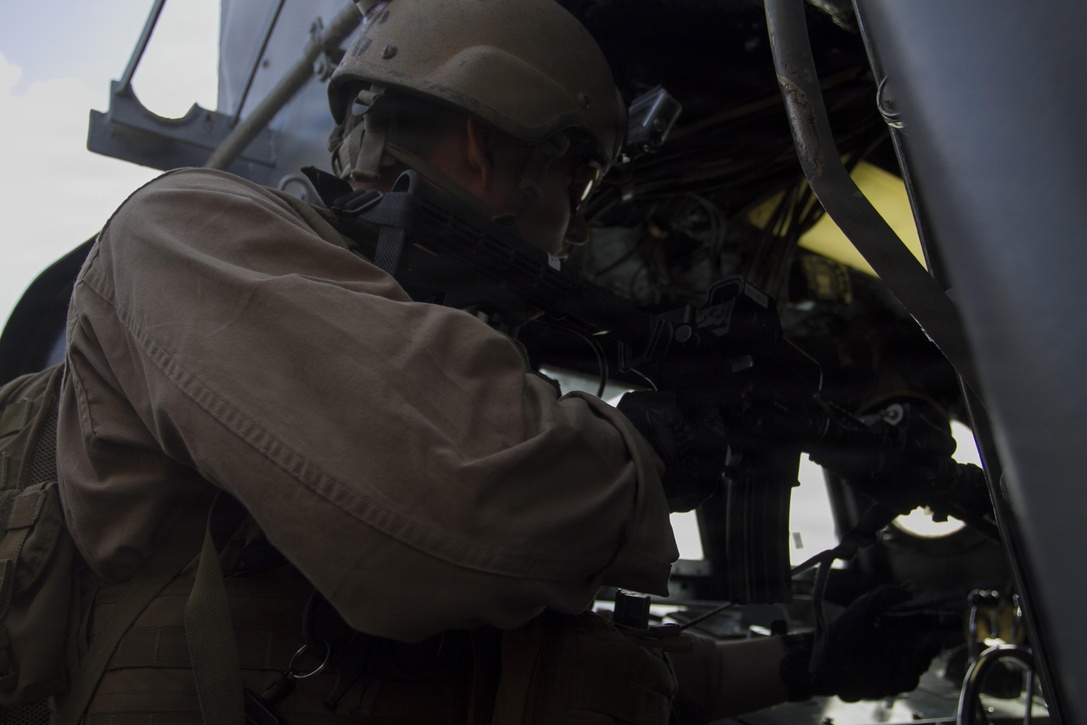 A Special Amphibious Reconnaissance Corpsman with the 24th Marine Expeditionary Unit’s Maritime Raid Force, a detachment from Force Reconnaissance Company, 2nd Reconnaissance Battalion, clears the engine room during a visit, board, search and seizure exercise aboard a Navy Landing Craft Utility, Jan. 15, 2015. The MRF conducted the VBSS exercise from the amphibious dock landing ship USS Fort McHenry (LSD 43). The 24th MEU is embarked on the ships of the Iwo Jima Amphibious Ready Group and deployed to maintain regional security in the U.S. 5th Fleet area of operations. (U.S. Marine Corps photo by Lance Cpl. Dani A. Zunun)