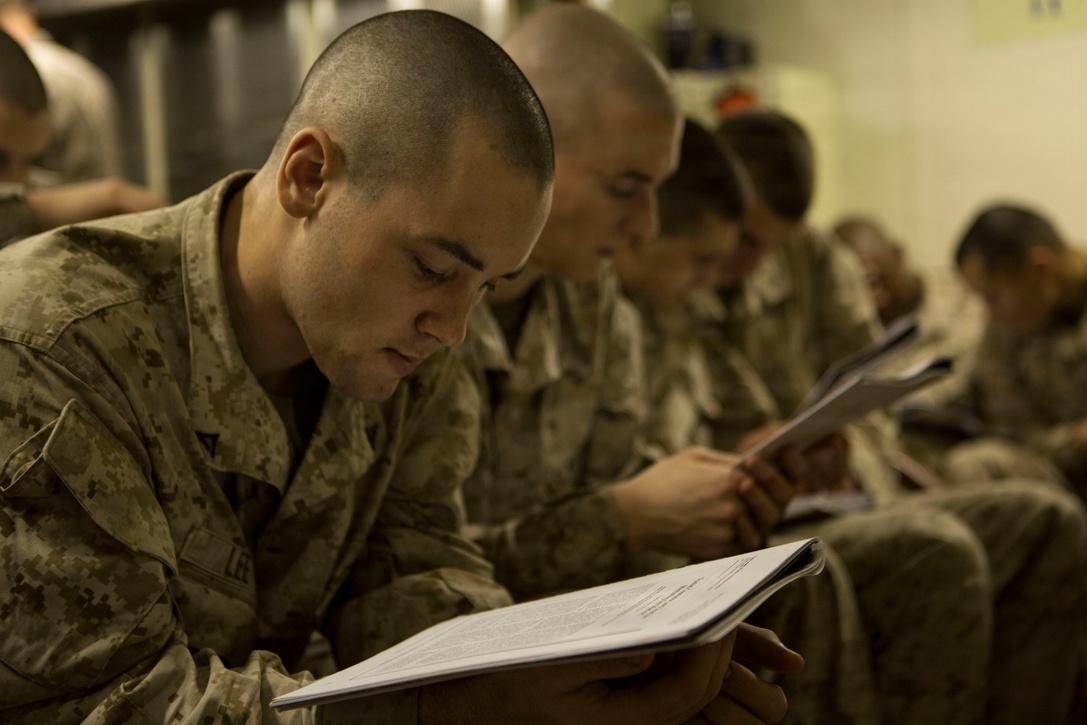 Lance Cpls. with Kilo Company, Battalion Landing Team 3rd Battalion, 6th Marine Regiment, 24th Marine Expeditionary Unit, read an article during  a Lance Corporal’s Leadership and Ethics Seminar aboard the amphibious dock landing ship USS Fort McHenry (LSD 43), Jan. 14, 2015. The 24th MEU is embarked on the ships of the Iwo Jima Amphibious Ready Group and deployed to maintain regional security in the U.S. 5th Fleet area of operations. (U.S. Marine Corps photo by Sgt. Devin Nichols)