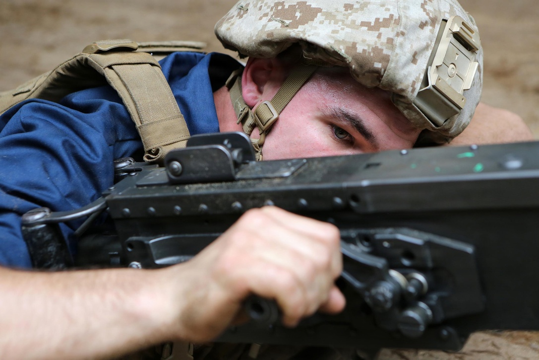 Lance Cpl. Robert Tully, an Amphibious Assault Vehicle Crewman with Kilo Company, Battalion Landing Team 3rd Battalion, 6th Marine Regiment, 24th Marine Expeditionary Unit, conducts crew-served weapon drills on a .50-caliber machine gun aboard the amphibious dock landing ship USS Fort McHenry (LSD 43), March 30, 2015. The 24th MEU is embarked on the ships of the Iwo Jima Amphibious Ready Group and deployed to maintain regional security in the U.S. 5th Fleet area of operations.  (U.S. Marine Corps photo by Sgt. Devin Nichols)