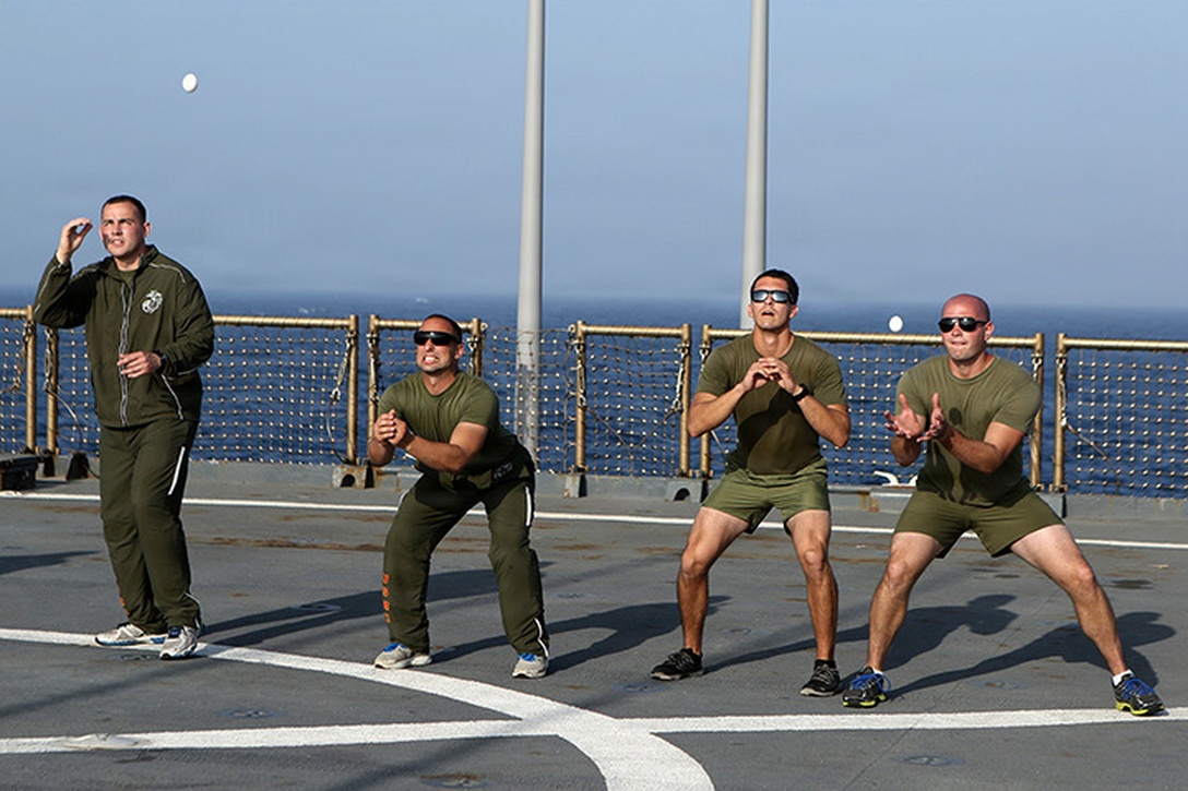 Marines with Kilo Company, Battalion Landing Team 3rd Battalion, 6th Marine Regiment, 24th Marine Expeditionary Unit, prepare to catch eggs in an egg toss competition during the “Halfway Block Party” aboard the amphibious dock landing ship USS Fort McHenry (LSD 43), April 2, 2015. The 24th MEU is embarked on the ships of the Iwo Jima Amphibious Ready Group and deployed to maintain regional security in the U.S. 5th Fleet area of operations.  (U.S. Marine Corps photo by Sgt. Devin Nichols)