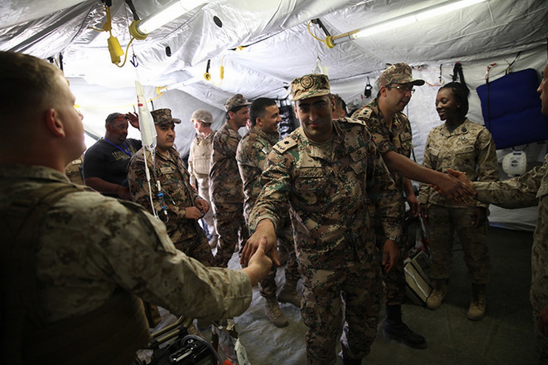 Sailors from Camp Lejeune based unit with augments from Navy Medicine West, are introduced to Jordan military personnel with Jordanian Role 2 Medical Team during casualty evacuation training in Wadi Al Shadiyah, Jordan, May 3, 2015. The 24th MEU is embarked on the ships of the Iwo Jima Amphibious Ready Group and deployed to maintain regional security in the U.S. 5th Fleet  area of operations. (U.S. Marine Corps photo by Lance Cpl. Austin A. Lewis)