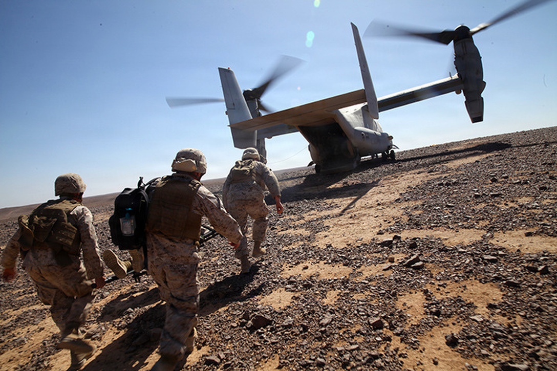 Sailors from Camp Lejeune based unit with augments from Navy Medicine West, carry a simulated casualty to an MV-22B Osprey during casualty evacuation training in Wadi Al Shadiyah, Jordan, May 3, 2015. The 24th MEU is embarked on the ships of the Iwo Jima Amphibious Ready Group and deployed to maintain regional security in the U.S. 5th Fleet  area of operations. (U.S. Marine Corps photo by Lance Cpl. Austin A. Lewis)