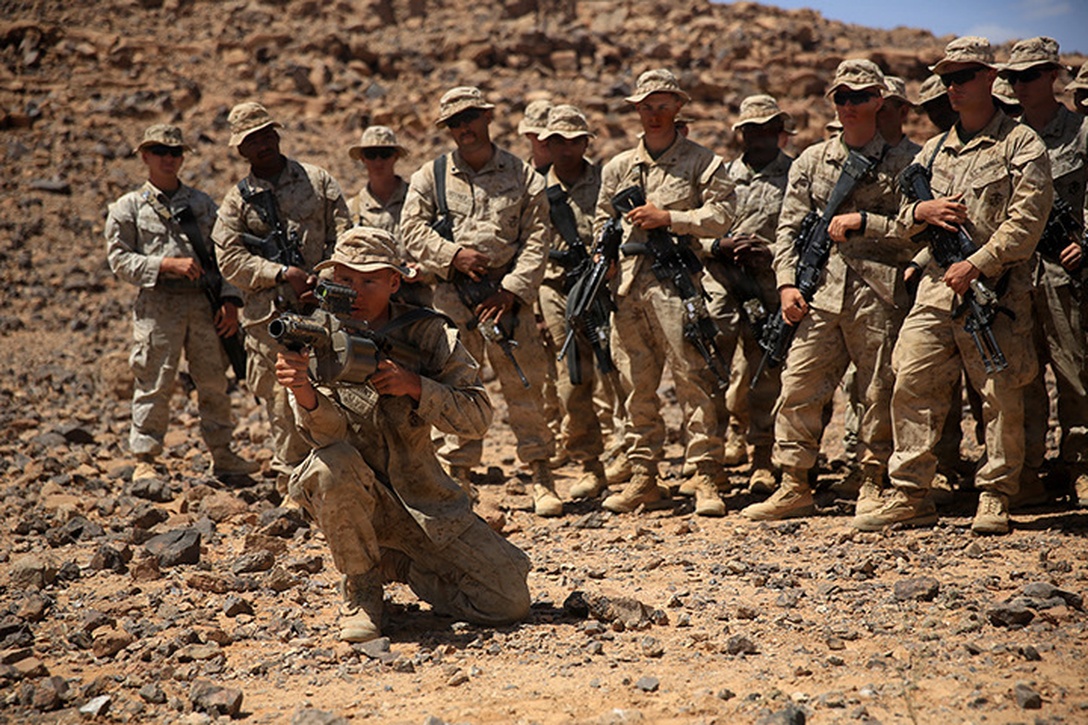 1505014-M-WA276-027: JORDAN (May 14, 2015) Lance Cpl. Dustin Quggins, a rifleman with Kilo Company, Battalion Landing Team 3rd Battalion, 6th Marine Regiment, 24th Marine Expeditionary Unit, demonstrates weapons procedures for the M32 Multi-shot Grenade Launcher, in preparation for a live-fire exercise, as part of Exercise Eager Lion 2015, in Jordan, May 14, 2015. Eager Lion is a recurring multinational exercise designed to strengthen military-to-military relationships, between partner nations and enhance regional security and stability. The 24th MEU is embarked on the ships of the Iwo Jima Amphibious Ready Group and deployed to maintain regional security in the U.S. 5th Fleet area of operations. (U.S. Marine Corps photo by Lance Cpl. Dani A. Zunun)