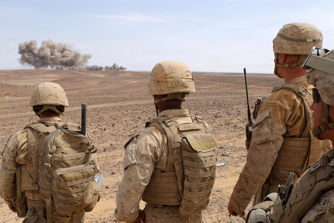 Marines with the Fire Support Team for Kilo Company, Battalion Landing Team 3rd Battalion, 6th Marine Regiment, 24th Marine Expeditionary Unit (MEU), observe ordnance from U.S. Air Force B-52 Stratofortress bombers during a combined arms live-fire event as part of exercise Eager Lion 2015 in Jordan, May 18, 2015. Eager Lion is a recurring multi-national exercise designed to strengthen military-to-military relationships, increase interoperability between partner nations and enhance regional security and stability. The 24th MEU is embarked on the ships of the Iwo Jima Amphibious Ready Group and is deployed to maintain regional security in the U.S. 5th Fleet area of operations. (U.S. Marine Corps photo by Sgt. Devin Nichols/Released)
