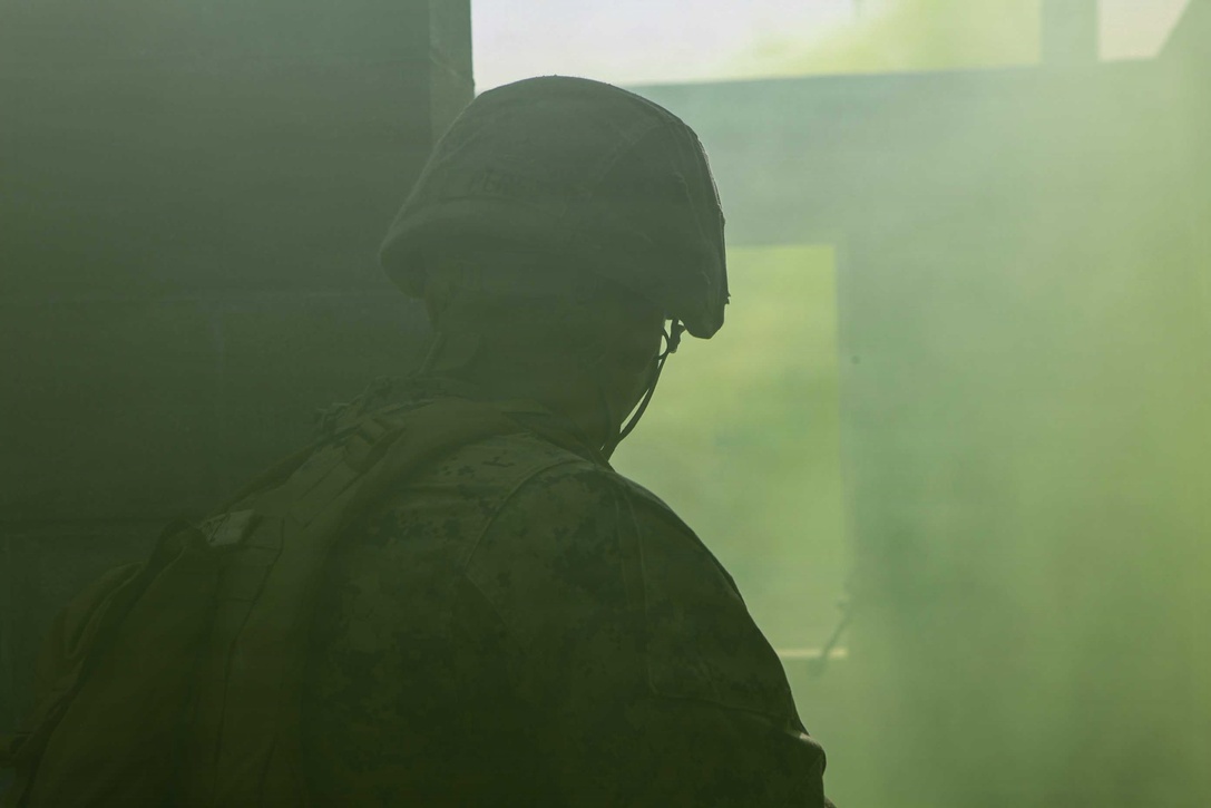 U.S. Marine Corps Lance Cpl. Rhaffy Perezazury, a mortarman with 1st Battalion 8th Marines, clears a room during a raid training exercise at Camp Lejeune, N.C., Sept. 22, 2020. The purpose of the exercise was to promote familiarization with ship to shore procedures and raid tactics for pre-deployment readiness with the 24th Marine Expeditionary Unit. (U.S. Marine Corps photo by Lance Cpl. Davis Harris)