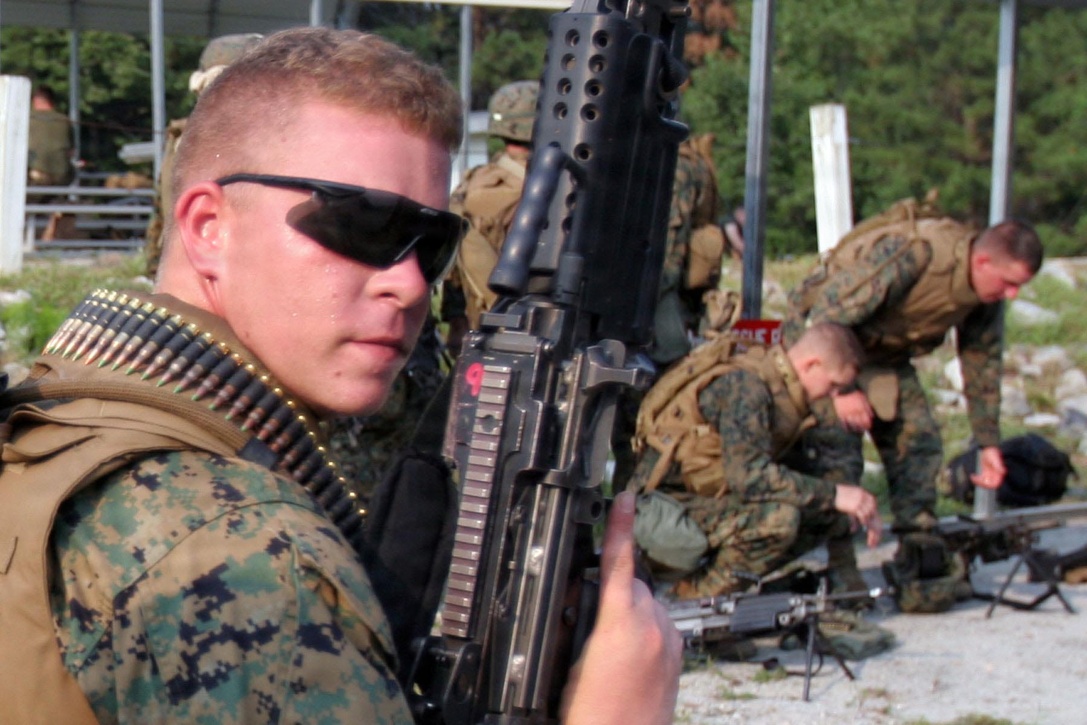 Pfc. Matt Brock, Battalion Landing Team 1st Battalion, 6th Marine Regiment, Headquarters and Support radio operator, waits for his turn on the M249 Squad Automatic Weapon range on Fort Pickett, Va., Aug. 27. After arriving at the battalion less than a month ago, he jumped at the chance to become a SAW gunner.