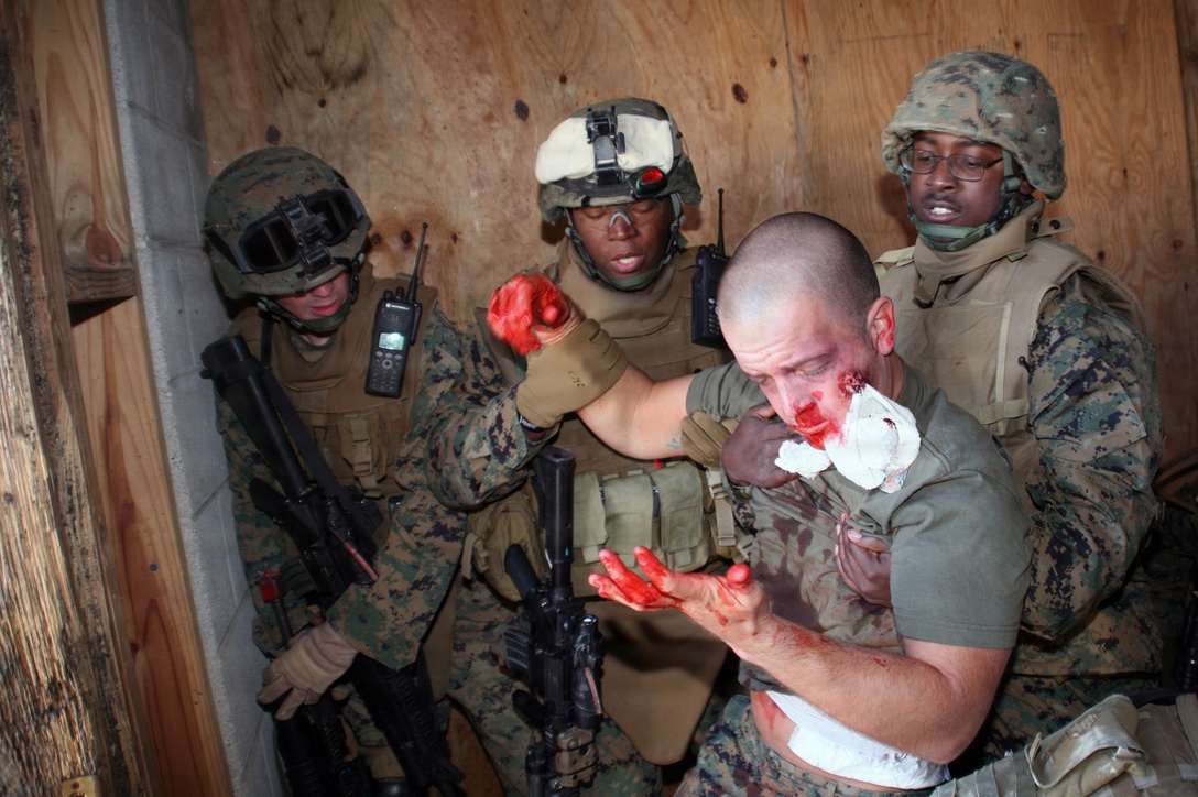 FORT PICKETT, Va.- Marines with Charlie Company, Battalion Landing Team 1st Battalion, 6th Marine Regiment traverse the MOUT faclity here during the 24th Marine Expeditionary Unit's Realistic Urban Training exercise.  Once entering the MOUT facility the Marines encountered role-playing insurgents, hostages, IED's and RPG's to provide the most life-like training available for situations the Marines could face during their upcoming deployment.