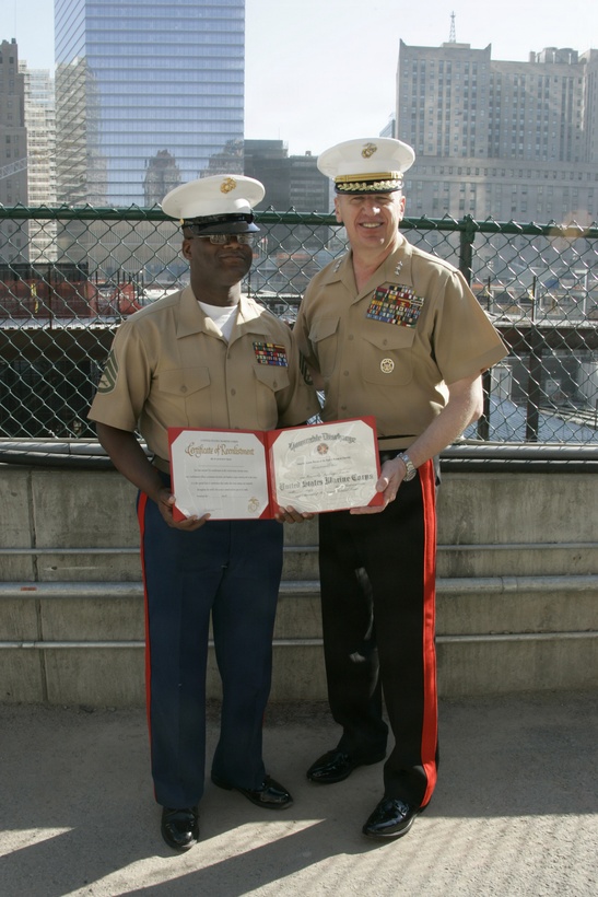 NEW YORK, N.Y. (May 22, 2009) – Staff Sgt. Deryck W. Smith with Special Purpose Marine Air Ground Task Force - New York, proudly accepts his re-enlistment certificate from Lt. Gen. Richard F. Natonski, commander, Marine Corps Forces Command, at ground zero May 22.  SPMAGTF-NY led by the 24th Marine Expeditionary Unit, re-enlisted three Marines where the World Trade Center once stood in New York City during Fleet Week. (US Marine Corps photo by Lance Cpl. Carl Payne)
