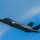 The F-35A Lightning II offically arrives at the 104th Fighter Wing, brings new era to Barnes Air National Guard Base A single-seat stealth fighter jet, identifiable as an F-35 Lightning II, is captured in flight against a partly cloudy blue sky. The aircraft is shown in a slight banking maneuver, revealing its distinctive delta-wing design and twin tail fins. Tail markings include the letters 'WI', suggesting a Wisconsin Air National Guard unit.
