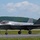 The F-35A Lightning II offically arrives at the 104th Fighter Wing, brings new era to Barnes Air National Guard Base A single F-35 Lightning II stealth fighter jet is taxiing on a runway at a military airfield. The aircraft bears the tail number '5817' and has a pilot visible in the cockpit. The setting appears to be a warm, clear day with green wooded hills visible in the background.