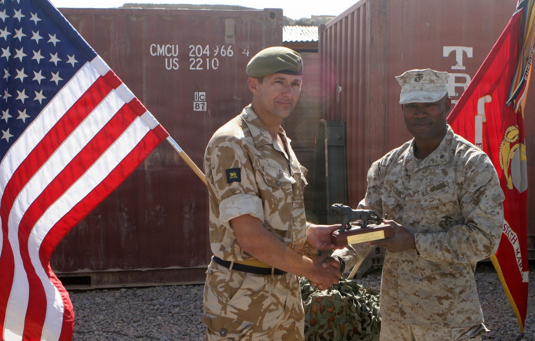 During the TOA ceremony Lt. Col. Doug M. Chalmers, commanding officer, 2nd Battalion, The Princess of Wales Royal Regiment, British Army awarded a bronzed tiger to Lt. Col. Tony Henderson, commanding officer, Battalion Landing Team 1st Battalion, 6th Marine Regiment, 24th MEU, ISAF serving as a token of gratitude and accomplishment.