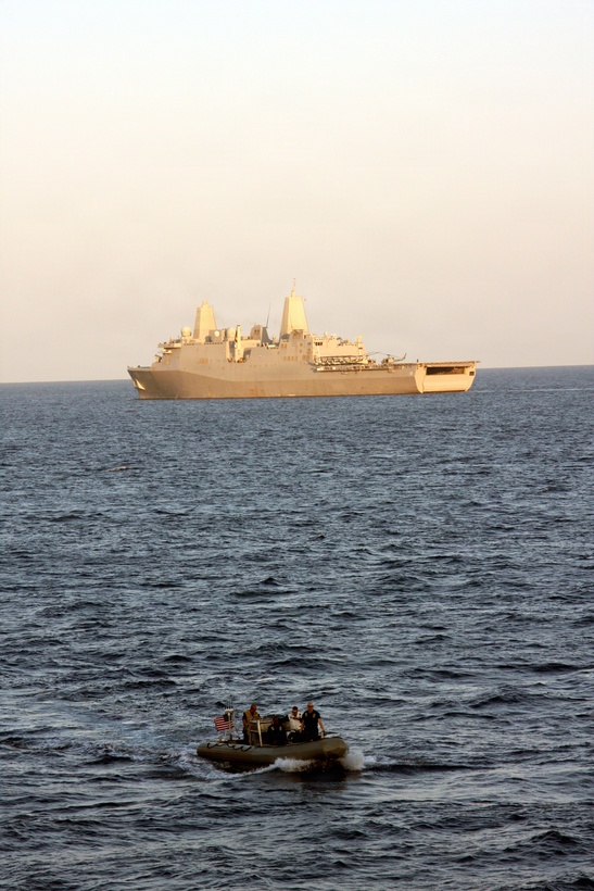 A Rigid Inflatable Boat travels from USS Mesa Verde to Uss Nassau to assist in transporting one of four 24th MEU assessment teams today. The teams went to four different locations in Northern Haiti that military and NGO's had not visited since the earthquake last week.