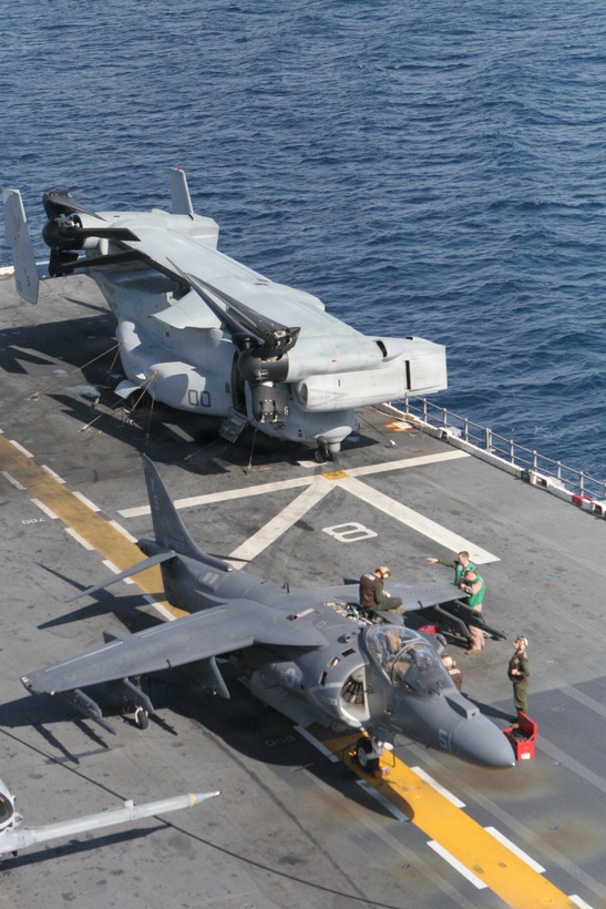 Marines perform routine maintenance on several aircraft while at sea.  The 24th MEU bagn its six-month deployment Jan. 20, 2010.