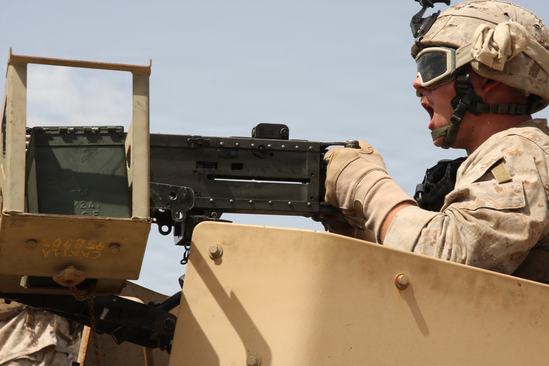 Marines of Combined Anti-Armor Team, Battalion Landing Team 1st Battalion, 9th Marine Regiment, 24th Marine Expeditionary Unit send live rounds down range during a live-fire machine gun range using the M240-B Medium Machine Gun and M2 .50 Caliber Heavy Machine Gun at a range in the mountainous terrain of Djibouti, Africa March 8. The 24th MEU is conducting several ranges and many other training exercises in Djibouti to keep the Marine's skills sharp while deployed. (Marine Corps photo by: Lance Cpl. David J. Beall)