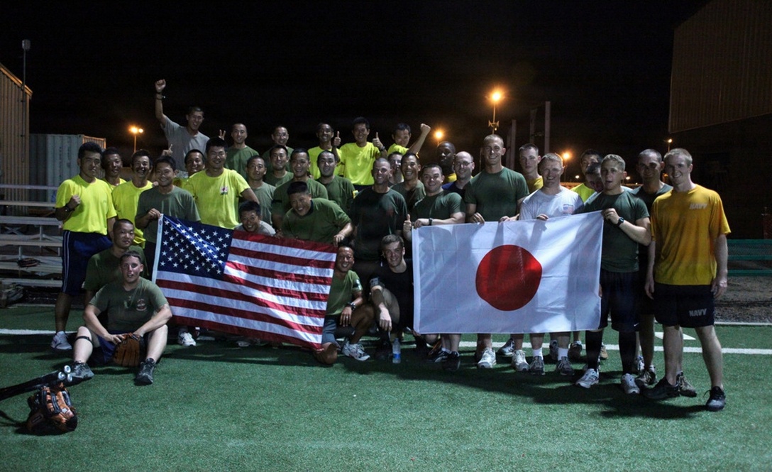 U.S. Marines and Sailors from the 24th MEU and USS Nassau pose for a photo with Japanese service members after they played a softball game against each other on Camp Lemonier, Djibouti, April 20, 2010.    (Official U.S. Marine Corps photo by MSgt. James Frank)