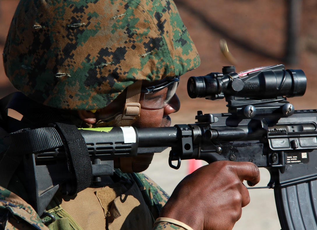 Lance Cpl. Gary L. Robinson, a small arms technician with the 24th Marine Expeditionary Unit, fires his rifle during a day of combat marksmanship training at range K406B on Camp Lejeune, N.C. Jan. 20. The 24th MEU conducted the training to sustain the combat marksmanship skills of the Marines and Sailors within the Command Element.