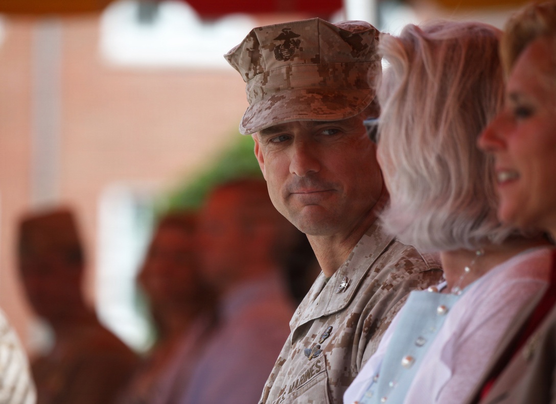 Colonel Frank Donovan looks to his wife prior to taking  command of the 24th  Marine Expeditionary Unit during an assumption of command ceremony at II Marine Expeditionary Force Headquarters on Camp Lejeune, N.C. May 6, 2011.