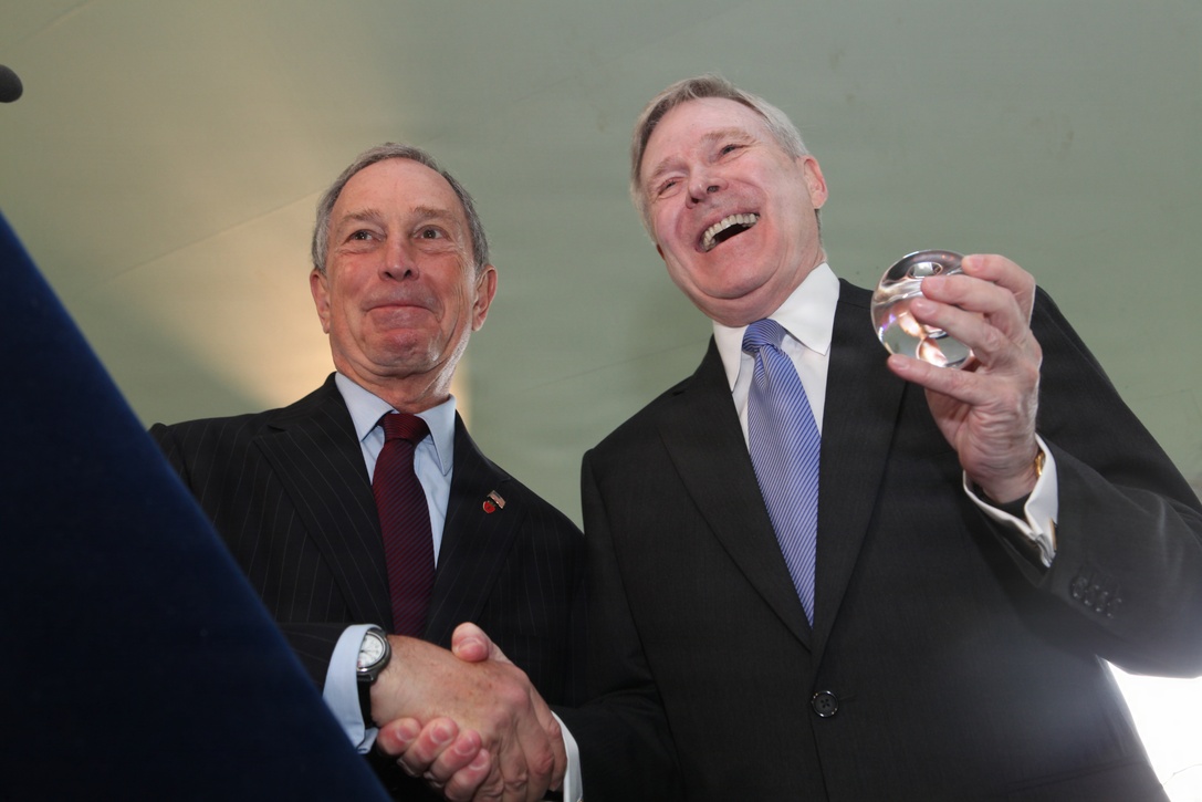 The Secretary of The Navy, the Honorable Ray Mabus, (right) shakes hands with New York City's mayor, the Honorable Michael Bloomberg, at Gracie Mansion after receiving a crystal apple symbolizing the city, May 26. The SEVNAV gave the mayor a plaque thanking the citizens of New York. Bloomberg invited Marines, Sailors, veterans and community leaders to the mansion to help kick of Fleet Week New York 2011.  Various units from II Marine Expeditionary Force and Marines Forces Reserve have organized under the 24th MEU to form the Special Purpose Marine Air Ground Task Force - New York. The Marines embarked on the Navy’s Amphibious Assault Ships, the USS Iwo Jima (LHD -7) and USS New York (LPD-21) to take part in Fleet Week New York 2011 from May 25 to June 1. The Marines will showcase the capabilities of the MAGTF, and also honor those who have served by participating in various events during the Memorial Day weekend.