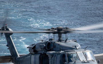 USS Carl Vinson (CVN 70) conducts a vertical replenishment with USS Stethem (DDG 63)