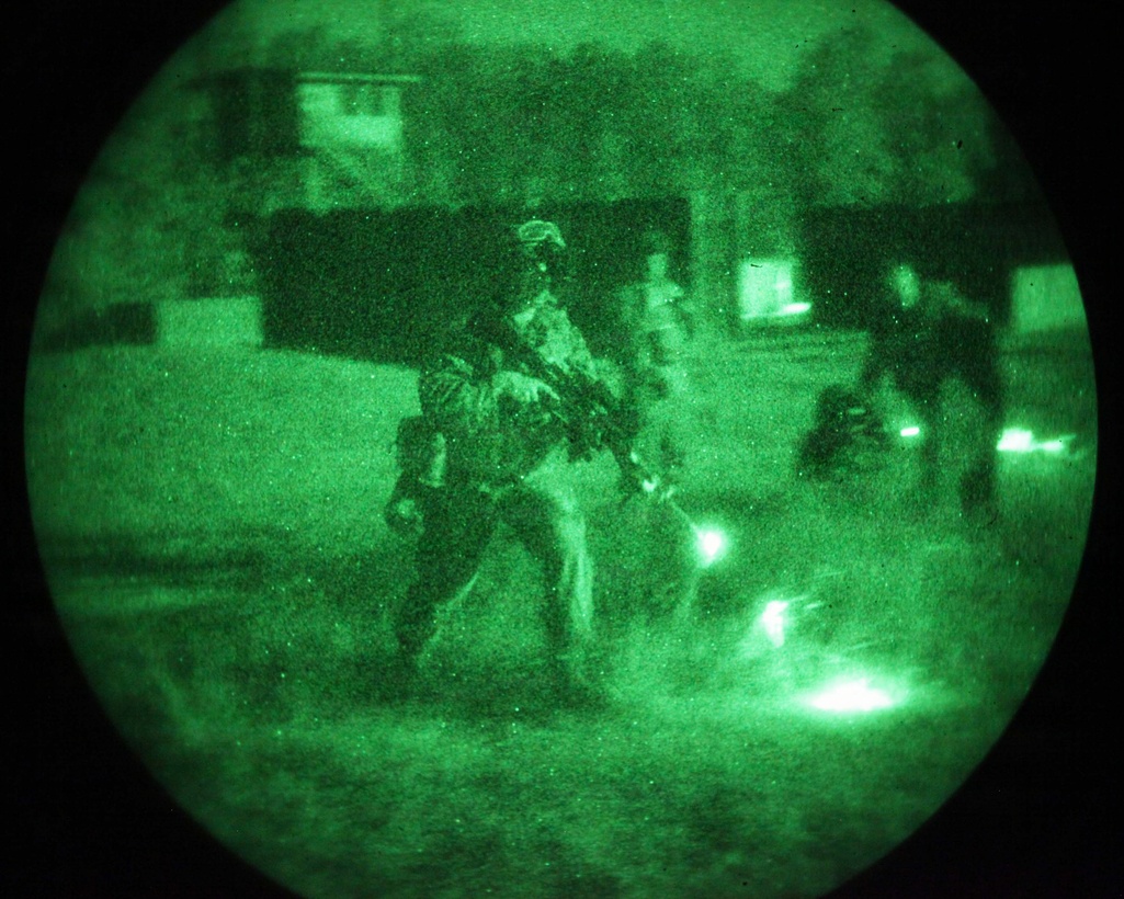 Marines and Sailors with 3rd Platoon, Charlie Company, 1st Battalion, 2nd Marine Regiment, fire at night with night vision goggles while conducting Military Operations in Urban Terrain training at the Urban Assault Course on Fort Pickett, Va., Sep. 12, 2011. More than 900 Marines and Sailors are taking part in the Deployment for Training exercise at Fort Pickett, Sept. 6-23. The battalion is scheduled to attach to the 24th Marine Expeditionary Unit a few days after the training.