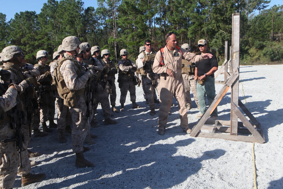 Capt. Travis Beyer, a lead instructor with Special Operations Training Group, teaches Marines with Headquarters and Service Company, 1st Battalion, 2nd Marine Regiment, currently attached to the 24th Marine Expeditionary Unit, during the SOTG’s Security Element Course Oct. 7 at Stone Bay’s Multipurpose Range.  The course focuses on close quarters tactics and shooting drills required to conduct a Visit, Board, Search, and Seizure (VBSS), and serves as a stepping stone to further VBSS training scheduled in the coming months.  The 24th MEU is scheduled to deploy early next year with 1st Battalion, 2nd Marine Regiment as their Battalion Landing Team.