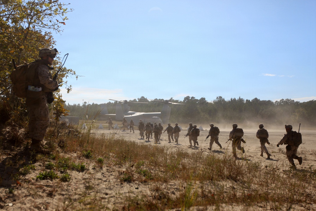 U.S. Marines with Bravo Company, 1st Battalion, 2nd Marine Regiment, board a V-22 Osprey after conducting a practice raid during the Vertical Assault Course aboard Camp Lejeune, N.C., Oct. 18, 2011. The Vertical Assault Course took place Oct. 10-21 to provide Marines and Sailors of Bravo Co. familiarization with air operations for their upcoming deployment as part the Battalion Landing Team for the 24th Marine Expeditionary Unit.