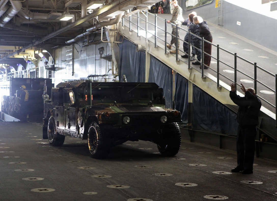 High Mobility Multi Wheeled Vehicles are loaded on to the USS Iwo Jima (LHD 7) from a Landing Craft Air Cushioned Hovercraft (LCAC) off the coast of Camp Lejeune, Nov. 30, 2011. The MEU is currently taking part in Composite Unit Training Exercise (COMPTUEX), scheduled to take place Nov. 28 to Dec. 21. The training is meant to develop cohesion between the MEU and Amphibious Squadron 8 (PHIBRON-8) in conducting amphibious operations, crisis response, and limited contingency operations while operating from the sea.
