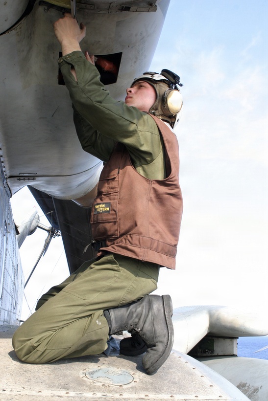 Cpl. Jayson Smith, Marine Medium Helicopter Squadron 365 (Reinforced) CH-53E flightline mechanic, performs daily maintenance on an aircraft April 3, 2006.  HMM-365 (Rein.) is the Aviation Combat Element of the 24th Marine Expeditionary Unit and is participating in an Expeditionary Strike Group Exercise as part of its pre-deployment work-ups.