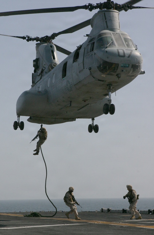 Marines from Battalion Landing Team 1st Battalion, 8th Marine Regiment, 24th Marine Expeditionary Unit perform a fast-roping exercise during a Vessel Boarding Search and Seizure training mission onto the flight deck of the USS Iwo Jima. Exercises like these prepare Marines to enter combat situations where the aid of helicopters can not be used for an extended period of time. (US Marine Corps photo by Lance Corporal Andrew J. Carlson)