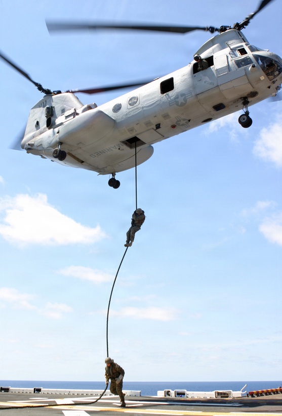 Marines with the 1st Marine Regiment/8th Marine Battalion's (1/8) Weapons Company and Alpha Company practice "Fast roping" on the flight deck of the USS Iwo Jima while on deployment with the 24th Marine Expeditionary Unit (MEU). (US Marine Corps photo by Lance Corporal Andrew Carlson)