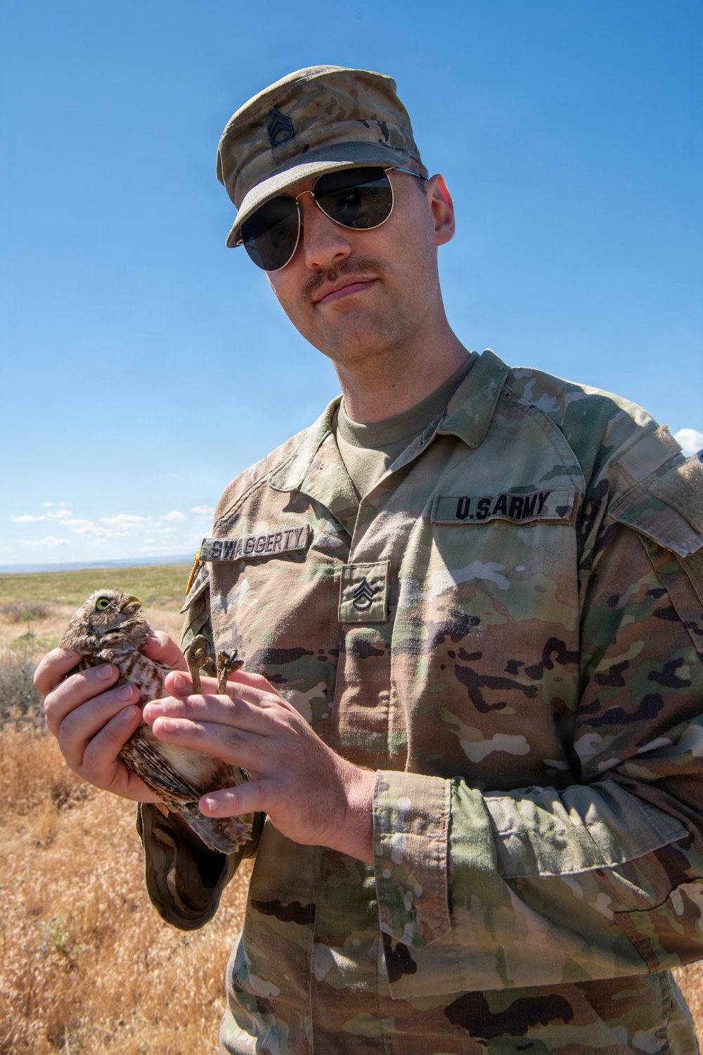 Oregon National Guard Soldiers and civilian employees learn about Eastern Oregon’s Borrowing Owls