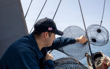Delbert D. Black Conducts Replenishment-at-Sea with USNS Arctic